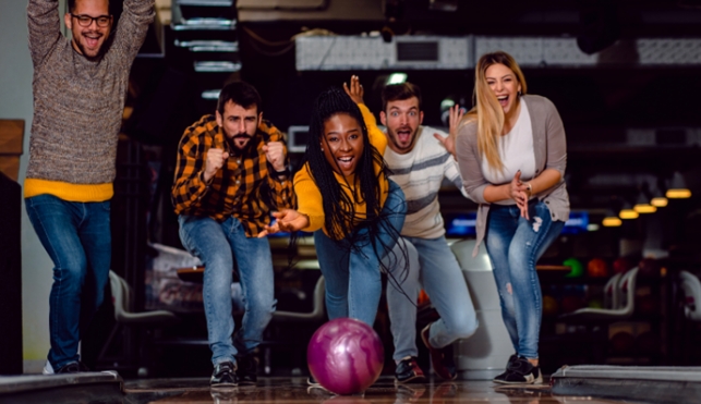 Group of friends bowling